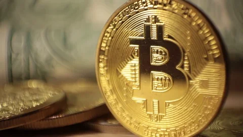 Cryptocurrency Bitcoin and dollars. Bit coins and cash Stock Footage 83212737