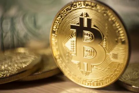 Cryptocurrency Bitcoin And Dollars. Bit Coins And Cash Stock Photos