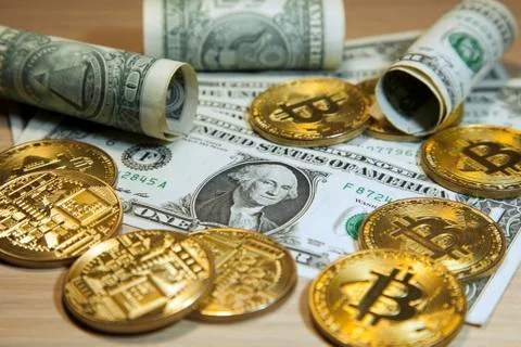 Cryptocurrency Bitcoin And Dollars. Bit Coins And Cash Stock Photos