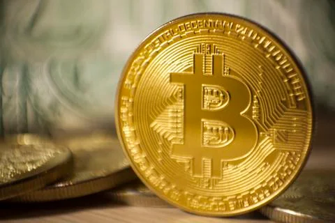 Cryptocurrency Bitcoin And Dollars. Bit Coins And Cash Stock Photos