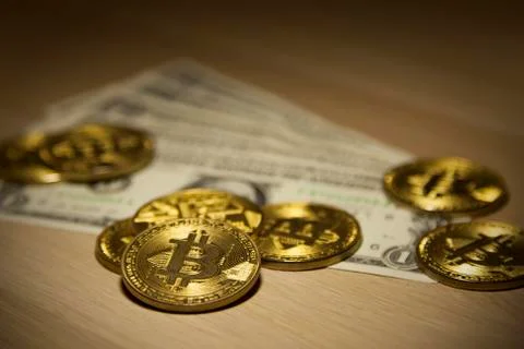 Cryptocurrency Bitcoin And Dollars. Bit Coins And Cash Stock Photos