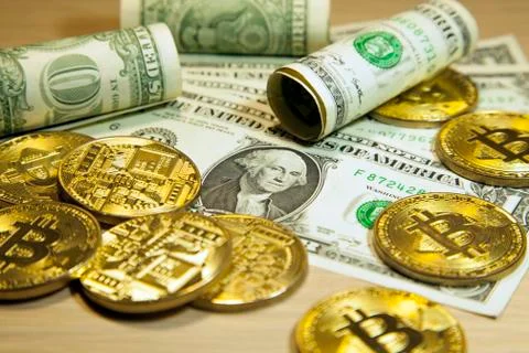 Cryptocurrency Bitcoin And Dollars. Bit Coins And Cash Stock Photos
