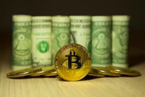Cryptocurrency Bitcoin And Dollars. Bit Coins And Cash Stock Photos