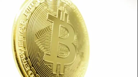 Cryptocurrency, Bitcoin (BTC). Macro shot of a Bitcoin. Vidéo 301400151