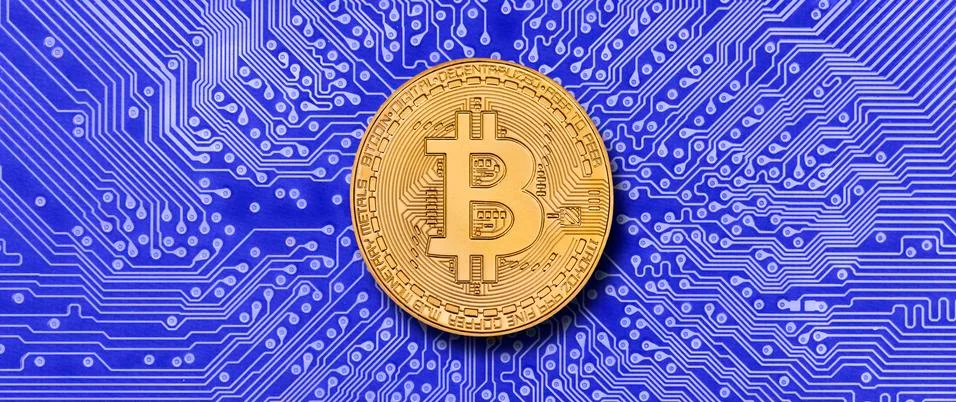 Cryptocurrency bitcoin laying on computer network Stock Photos