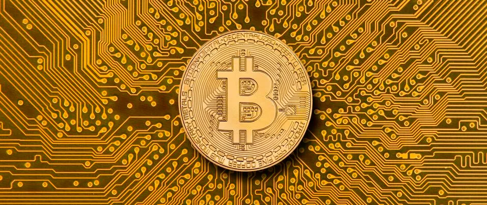 Cryptocurrency bitcoin laying on computer network Stock Photos