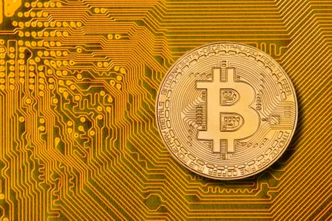 Cryptocurrency bitcoin laying on computer network Stock Photos