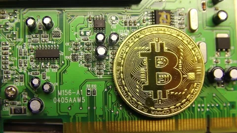 Cryptocurrency bitcoin lies on a microcircuit close-up 스톡 동영상 230488560
