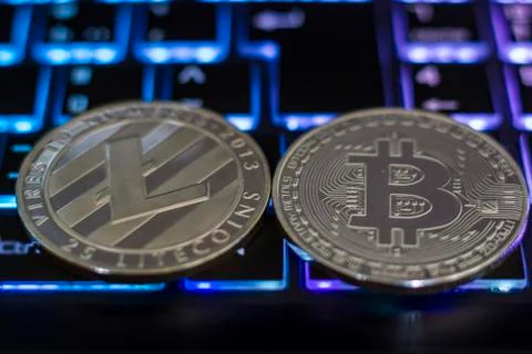 Cryptocurrency coins on computer keyboard Stock Photos