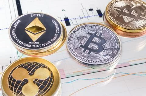 Cryptocurrency coins over tablet screen Stock Photos