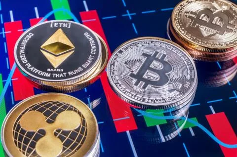 Cryptocurrency coins over tablet screen Stock Photos