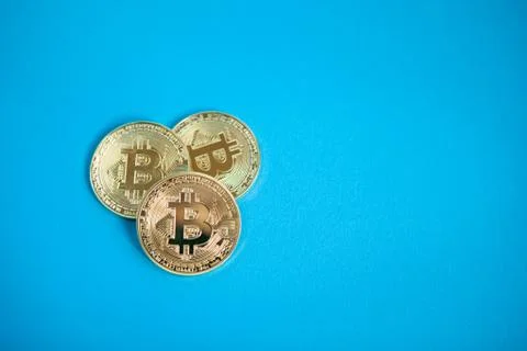 Cryptocurrency concept, Bitcoin on blue background with copy space Stock Photos
