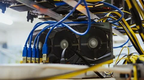 Cryptocurrency concept. GPU render farm. Mining background on high-end hardwear. Stock Photos