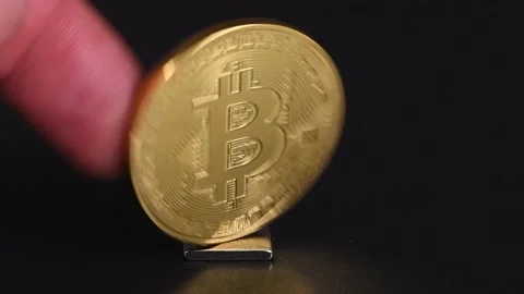 Cryptocurrency exchange rate concept. Bitcoin on a black background Stock Footage 237861927