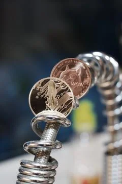 Cryptocurrency feather coin Stock Photos