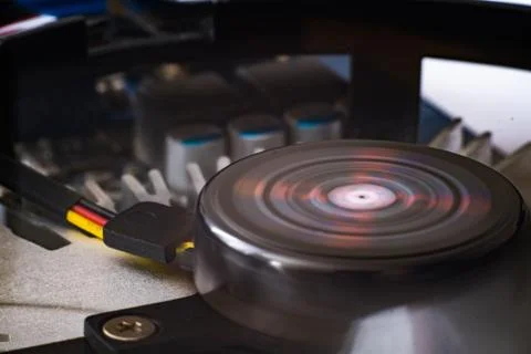 Cryptocurrency mining concept with one golden Ethereum coin on top of a compu 스톡 사진
