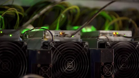 Cryptocurrency mining equipment on large farm. ASIC miners on stand racks mine Stockbeeldmateriaal 126122937
