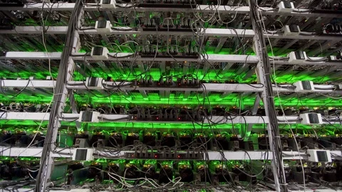 Cryptocurrency mining equipment on large farm. ASIC miners on stand racks mine Stockbeeldmateriaal 126409762