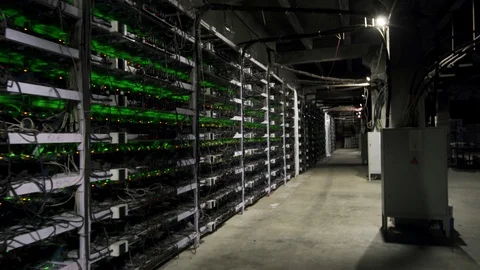 Cryptocurrency mining equipment on large farm. ASIC miners on stand racks mine Video stock 126690810