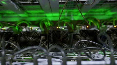 Cryptocurrency mining equipment on large farm. ASIC miners on stand racks mine Stockbeeldmateriaal 126690832