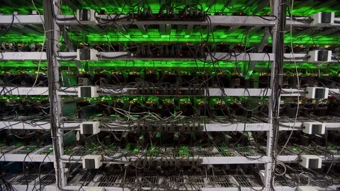 Cryptocurrency mining equipment on large farm. ASIC miners on stand racks mine Stockbeeldmateriaal 126690871