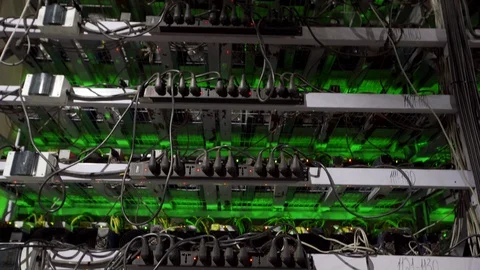 Cryptocurrency mining equipment on large farm. ASIC miners on stand racks mine Stockbeeldmateriaal 126690889