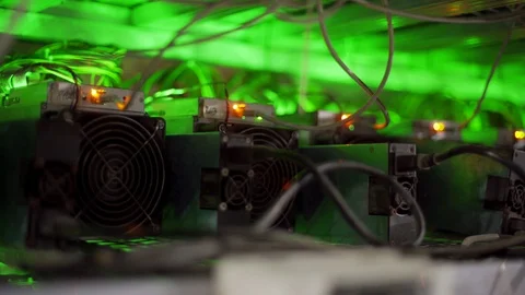 Cryptocurrency mining equipment on large farm. ASIC miners on stand racks mine Video stock 130059982