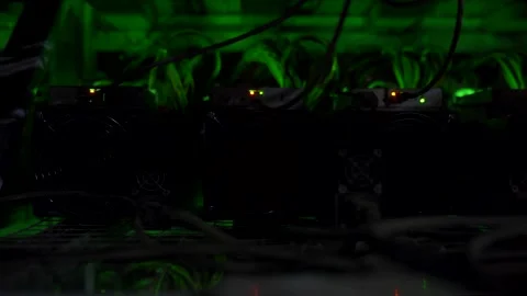 Cryptocurrency mining equipment on large farm. ASIC miners on stand racks mine Stock Footage 131314018