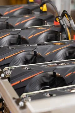 Cryptocurrency mining farm, extraction of bitcoins, ethereum. Fans spinning o Stock Photos