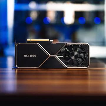 Cryptocurrency mining GPU rig computer graphics card on the table, close-up Stock Photos