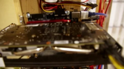 Cryptocurrency mining rig with video cards in home office. Out of focus til.. 스톡 동영상 337346812