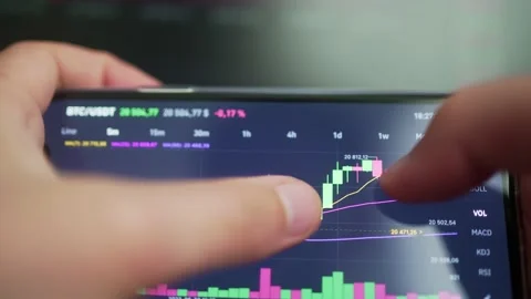 Cryptocurrency price chart on the phone screen Stock Footage 201138210