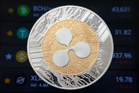 Cryptocurrency ripple coin on table and digital currency money concept Stock Photos