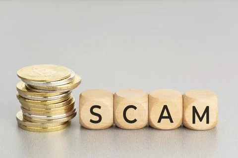 Cryptocurrency Scam concept. Stacked crypto coins and wooden blocks with text. Foto stock