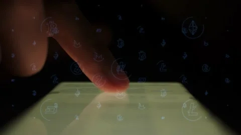 Cryptocurrency thumbnails appear while using a mobile phone Stock Footage 237505668