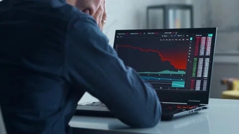Cryptocurrency Trader at his Workplace in front of a Computer. Laptop Monitor Stock Footage 197061969