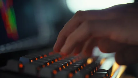 A cryptocurrency trader intently monitors a live candlestick chart on the tr Stock Footage 331458605