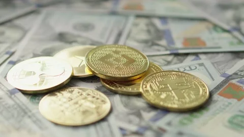 Cryptocurrency virtual money Bitcoin BTC and US dollar banknotes. Stock Footage 233175910