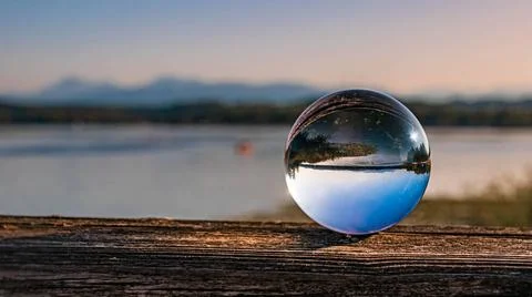 Crystal ball alpine summer landscape shot at the famous Waginger See, Wagi... Stock Photos
