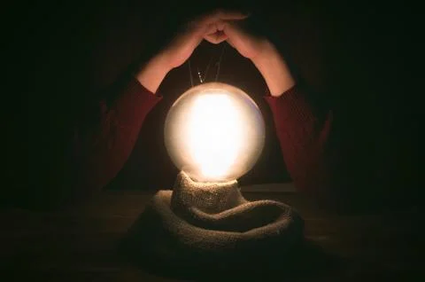 Crystal ball and fortune teller hands. Divination concept. The spiritual sean Stock Photos