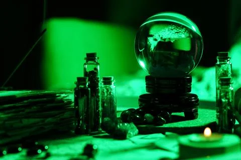Crystal ball and magic attributes on table Stock Photos