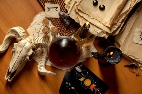 Crystal ball and magic attributes on table, top view Stock Photos