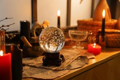 Crystal ball and magic attributes on table Stock Photos