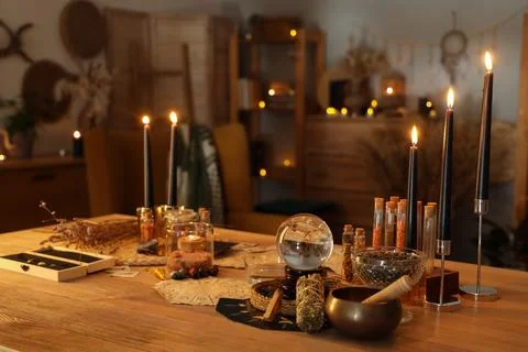 Crystal ball and magic attributes on table Stock Photos