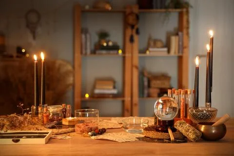Crystal ball and magic attributes on table Stock Photos