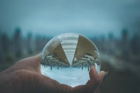 Crystal ball on the beach Stock Photos