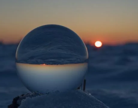 A crystal ball bottom view while sunset on snow in thuringia Stock Photos