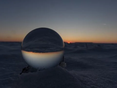 A crystal ball bottom view while sunset on snow in thuringia Stock Photos