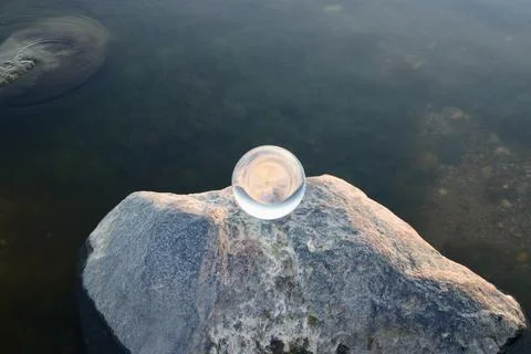Crystal ball on boulder Stock Photos