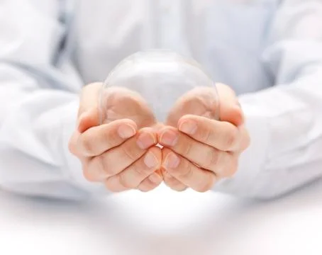 Crystal ball in hands Stock Photos